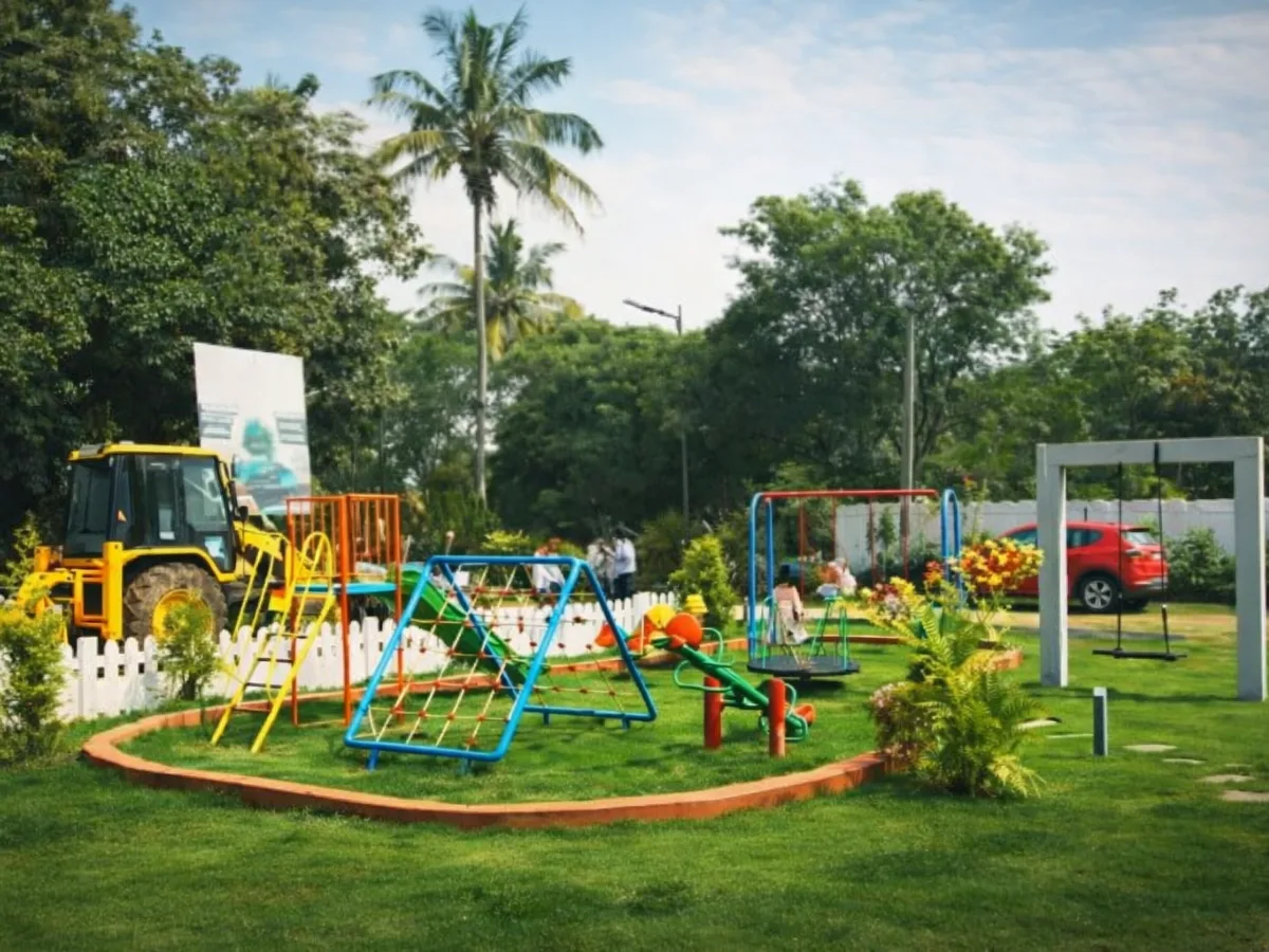 Gated farmland community amenities featuring children’s park and greenery