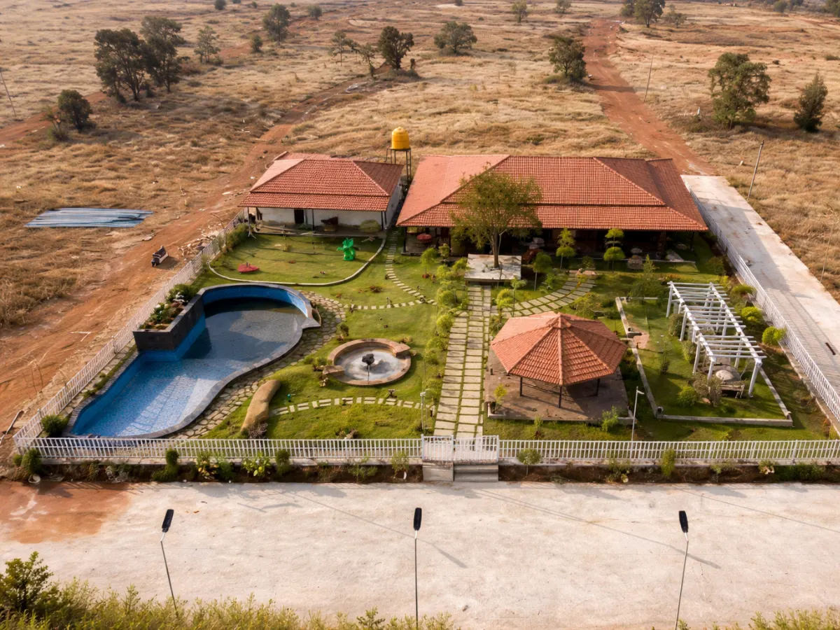 Community amenities at Tamara Valley farmland including kids play area swimming pool gazebo and restaurant