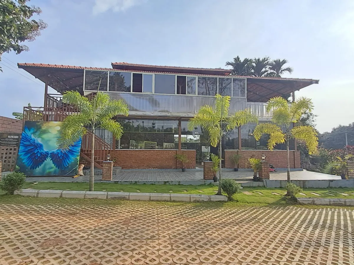 Community restaurant and outdoor dining area at Vasudha Kalpataru farmland